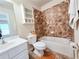 Bathroom with a sink, toilet, cabinet and tiled bathtub with shower at 2921 Royston Dr, Duluth, GA 30097