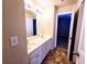 Bathroom featuring a double sink vanity and view into bedroom and shower at 2921 Royston Dr, Duluth, GA 30097