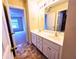 Bathroom featuring a double sink vanity and view into bedroom and shower at 2921 Royston Dr, Duluth, GA 30097