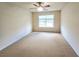 Bright bedroom featuring a ceiling fan and a window providing natural light at 2921 Royston Dr, Duluth, GA 30097