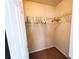 Closet with shelving and a hanging rack for clothes and accessories at 2921 Royston Dr, Duluth, GA 30097
