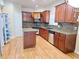 Modern kitchen with stainless steel appliances, granite countertops, and hardwood floors at 2921 Royston Dr, Duluth, GA 30097