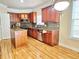 Well-appointed kitchen featuring stainless steel appliances, granite countertops, and custom cabinets at 2921 Royston Dr, Duluth, GA 30097