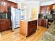 Updated kitchen with stainless steel appliances, granite countertops, and a center island at 2921 Royston Dr, Duluth, GA 30097