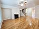 Bright living room showcasing a fireplace, hardwood floors, and open space at 2921 Royston Dr, Duluth, GA 30097