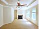 Spacious living room with neutral carpet, fireplace and natural light at 2921 Royston Dr, Duluth, GA 30097