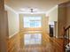 Sunny living room featuring hardwood floors, a large window, and a fireplace at 2921 Royston Dr, Duluth, GA 30097