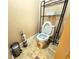 Cozy toilet room featuring a toilet, overhead storage, and stylish accessories at 2921 Royston Dr, Duluth, GA 30097