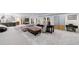 Finished basement featuring a living area, wet bar, and sliding glass doors to the backyard at 3680 Sewell Mill Rd, Marietta, GA 30062