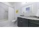 Bathroom with white marble walls and floors and a dark marble countertop at 3680 Sewell Mill Rd, Marietta, GA 30062