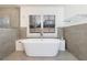 Bright and modern bathroom featuring a soaking tub and a frameless glass shower at 3680 Sewell Mill Rd, Marietta, GA 30062