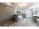 Elegant bathroom featuring a soaking tub, glass shower, pebble floor, and double vanity at 3680 Sewell Mill Rd, Marietta, GA 30062