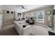 Spacious bedroom area with comfortable seating, decor and view from multiple large windows at 3680 Sewell Mill Rd, Marietta, GA 30062