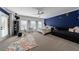 Bright bedroom with blue accent wall, a window seat, and neutral carpet at 3680 Sewell Mill Rd, Marietta, GA 30062
