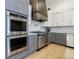 Modern kitchen with stainless steel appliances, granite countertops, and custom cabinets at 3680 Sewell Mill Rd, Marietta, GA 30062