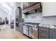 Gourmet kitchen featuring stainless steel appliances, custom cabinetry, and granite countertops at 3680 Sewell Mill Rd, Marietta, GA 30062