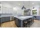 Modern kitchen featuring granite countertops, stainless steel appliances, and a center island with bar stool seating at 3680 Sewell Mill Rd, Marietta, GA 30062