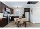 The kitchen features stainless steel appliances, dark cabinets, and a movable kitchen island at 3680 Sewell Mill Rd, Marietta, GA 30062