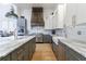 Stylish kitchen with a farmhouse sink, granite countertops, stainless steel appliances, and custom cabinetry at 3680 Sewell Mill Rd, Marietta, GA 30062