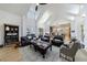 Spacious living room with natural light, beamed ceilings, and hardwood flooring at 3680 Sewell Mill Rd, Marietta, GA 30062