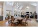 Open-concept living room with high ceilings, large windows, a fireplace, and seamless access to the outdoor porch at 3680 Sewell Mill Rd, Marietta, GA 30062