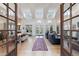 Bright open-concept living room with soaring ceilings and hardwood floors at 3680 Sewell Mill Rd, Marietta, GA 30062