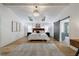 Bright main bedroom boasting wood floors, tray ceiling, ensuite access, and a serene aesthetic at 3680 Sewell Mill Rd, Marietta, GA 30062