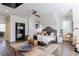 Spacious main bedroom boasts wood floors, a decorative ceiling fan and ensuite bathroom at 3680 Sewell Mill Rd, Marietta, GA 30062