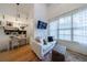 Bright room with hardwood floors, built in shelves, and a cozy sitting area at 3680 Sewell Mill Rd, Marietta, GA 30062