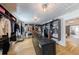 Spacious walk-in closet featuring custom shelving, center island, and ensuite access at 3680 Sewell Mill Rd, Marietta, GA 30062