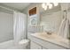Bright bathroom with tub, shower and window at 518 Hill St Se, Atlanta, GA 30312
