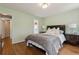 Bedroom with hardwood floors and neutral decor with views into the ensuite at 518 Hill St Se, Atlanta, GA 30312