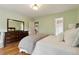 Bedroom with hardwood floors and a view into the ensuite at 518 Hill St Se, Atlanta, GA 30312