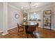 Well-lit dining room featuring contemporary light fixture and built-in shelving at 518 Hill St Se, Atlanta, GA 30312