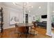 Open concept dining area featuring modern lighting and an adjacent seating area at 518 Hill St Se, Atlanta, GA 30312