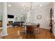 Bright dining area with contemporary light fixture, and open living space at 518 Hill St Se, Atlanta, GA 30312