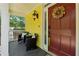 Cozy front porch featuring stylish chairs, a dark red door, and vibrant yellow siding at 518 Hill St Se, Atlanta, GA 30312