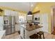 This kitchen has stainless steel appliances, a granite island with seating, and ample cabinet space at 518 Hill St Se, Atlanta, GA 30312