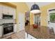 This kitchen has stainless steel appliances, a granite island with seating, and ample cabinet space at 518 Hill St Se, Atlanta, GA 30312