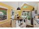 Bright kitchen with stainless appliances, a granite island with bar seating, vaulted ceiling, and an eat-in area at 518 Hill St Se, Atlanta, GA 30312