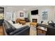 Spacious living area with a fireplace, large windows, and stylish seating arrangement at 518 Hill St Se, Atlanta, GA 30312
