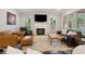 Cozy living room featuring a fireplace, large windows, and plush seating at 518 Hill St Se, Atlanta, GA 30312