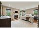 Inviting main bedroom with fireplace, hardwood floors, white rug, and natural light at 518 Hill St Se, Atlanta, GA 30312