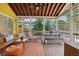 Inviting screened porch with comfortable seating, dining table, and a view of the backyard at 518 Hill St Se, Atlanta, GA 30312
