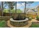 Beautiful stone water feature with lion head in backyard providing a calming and visually appealing focal point at 518 Hill St Se, Atlanta, GA 30312