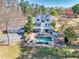 Stunning aerial view of a home featuring a pool and expansive backyard with a detached garage at 1768 Hood Rd, Dacula, GA 30019