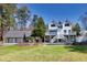 Stunning home with an expansive lawn, a three car garage and an outdoor entertainment area at 1768 Hood Rd, Dacula, GA 30019
