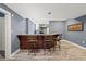 Entertaining bar featuring seating and access to the kitchen at 1768 Hood Rd, Dacula, GA 30019