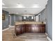 Open basement design featuring recessed lighting, stylish flooring, and a granite countertop bar at 1768 Hood Rd, Dacula, GA 30019