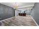 Spacious basement features recessed lighting, stylish flooring, and a granite countertop bar at 1768 Hood Rd, Dacula, GA 30019